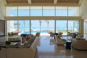 Beach house interior design with large glass windows