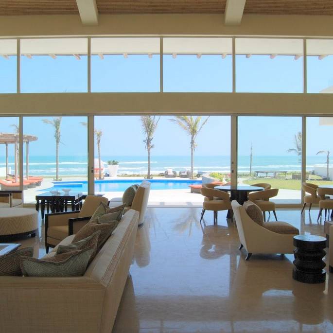 Beach house interior design with large glass windows