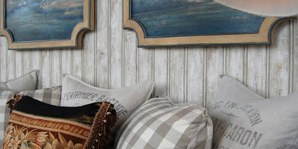 Gray plaid sofa with decorative pillows