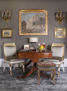 Elegant desk and ornate armchairs