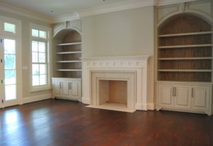 Newly remodeled living room with fireplace and built-in bookshelves