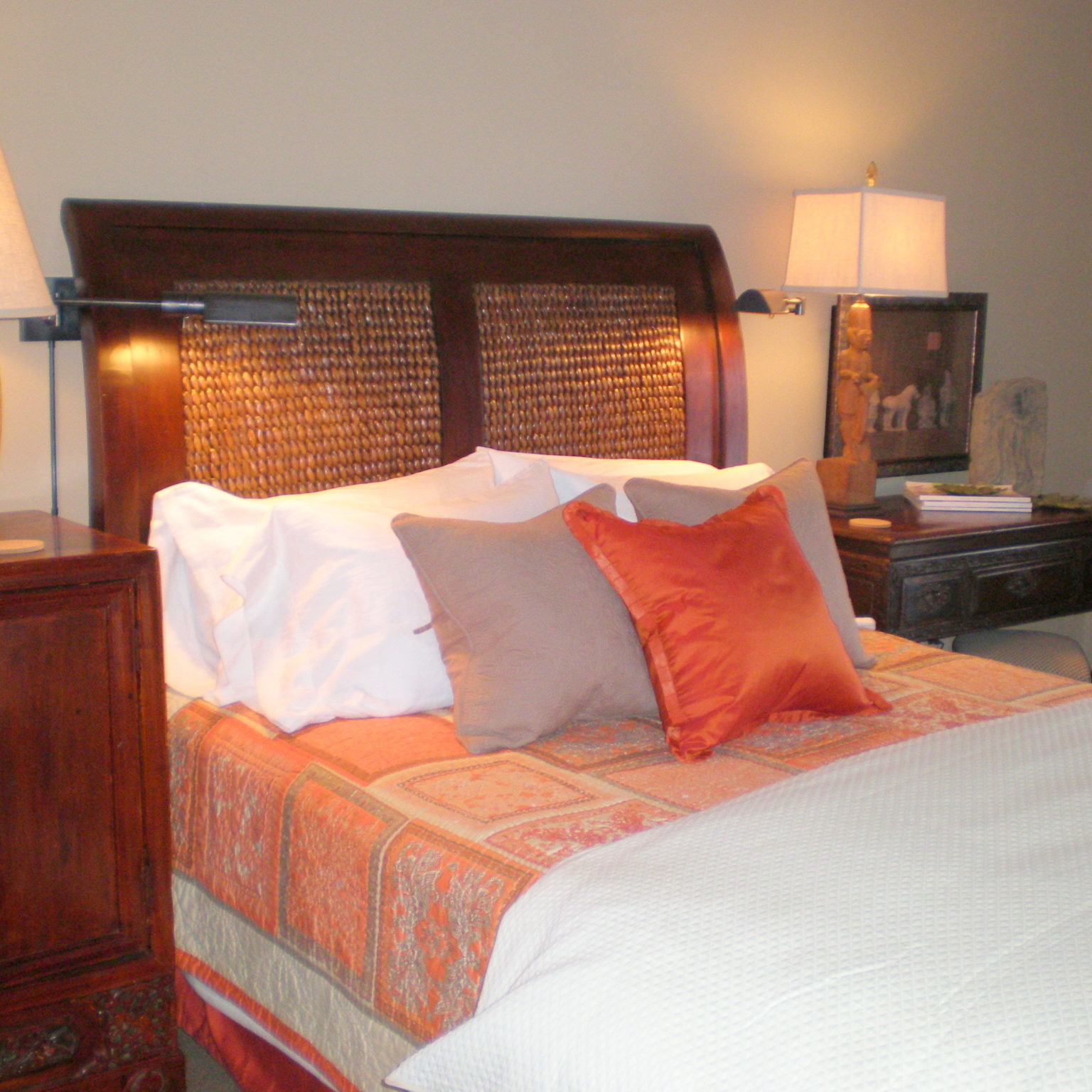 Bedroom interior design with orange silk accents