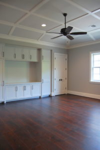 Newly remodeled living room with many cabinets