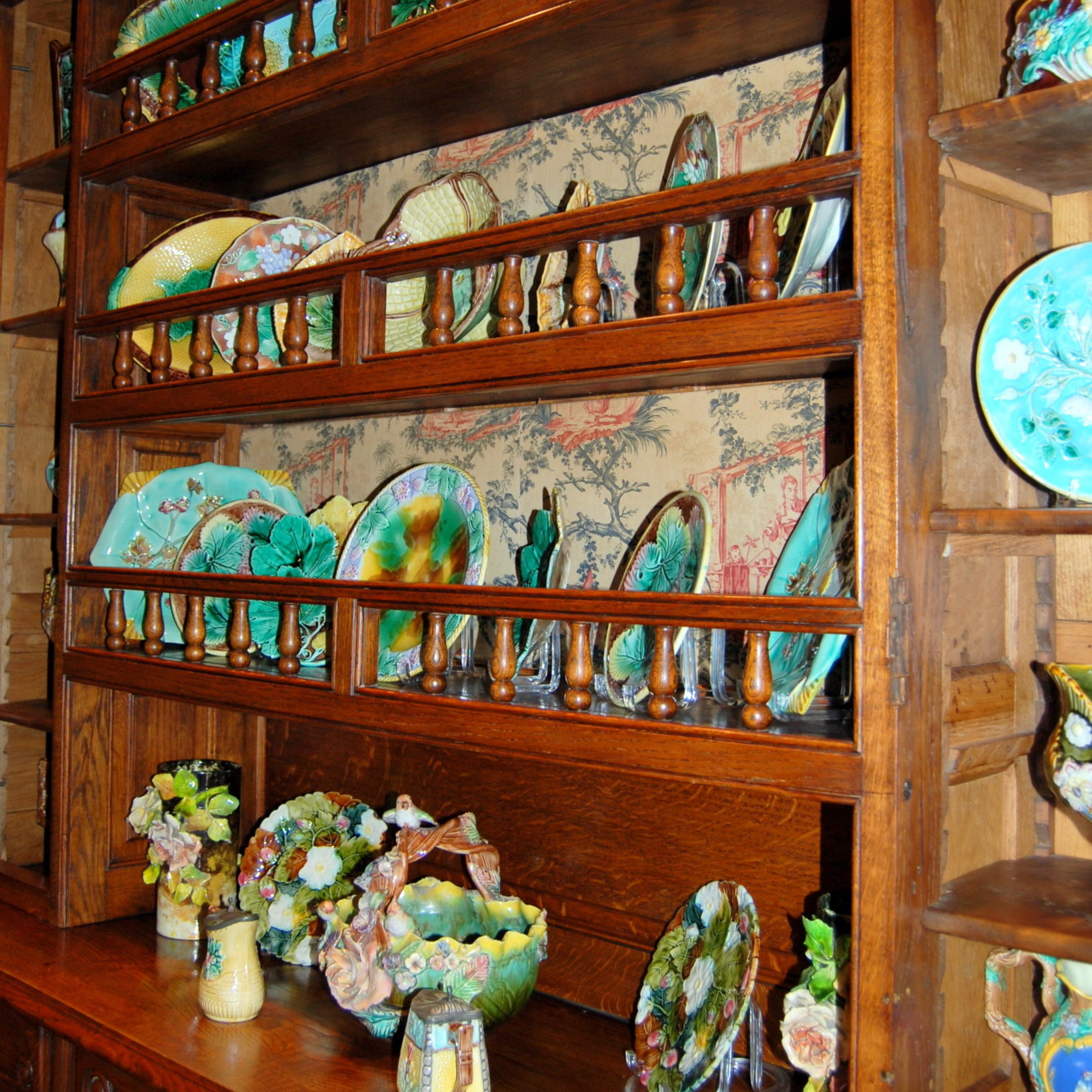 Decorative china cabinet with a variety of plates