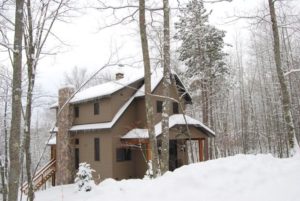 Exterior of a lake house in the snow