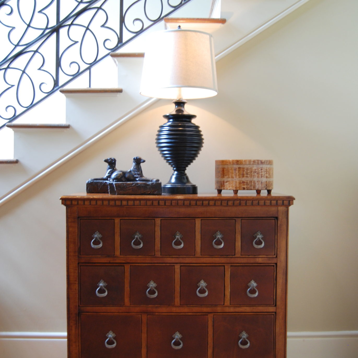 Decorative dresser by a staircase