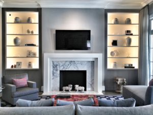 Living room interior design with marble fireplace and flatscreen tv