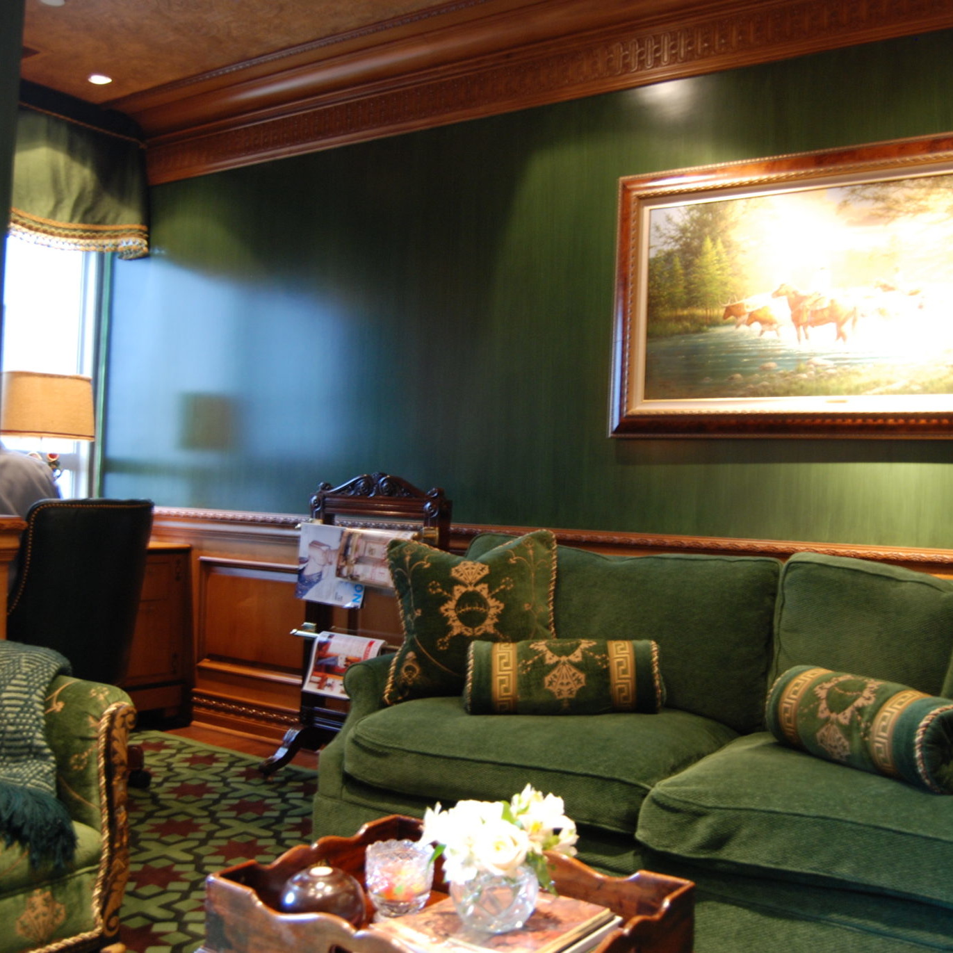 Green and gold living room interior design with velvet sofas