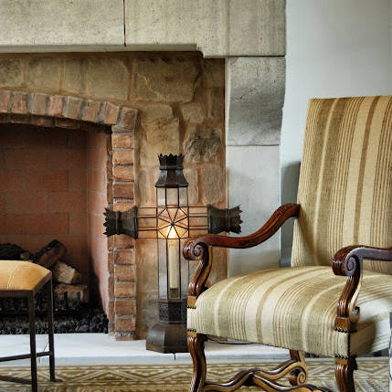 Rustic armchair and fireplace