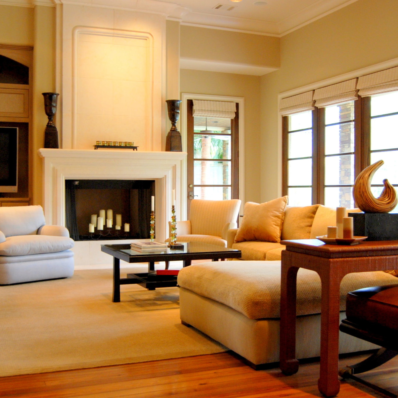 Living room interior design with fireplace and large open windows