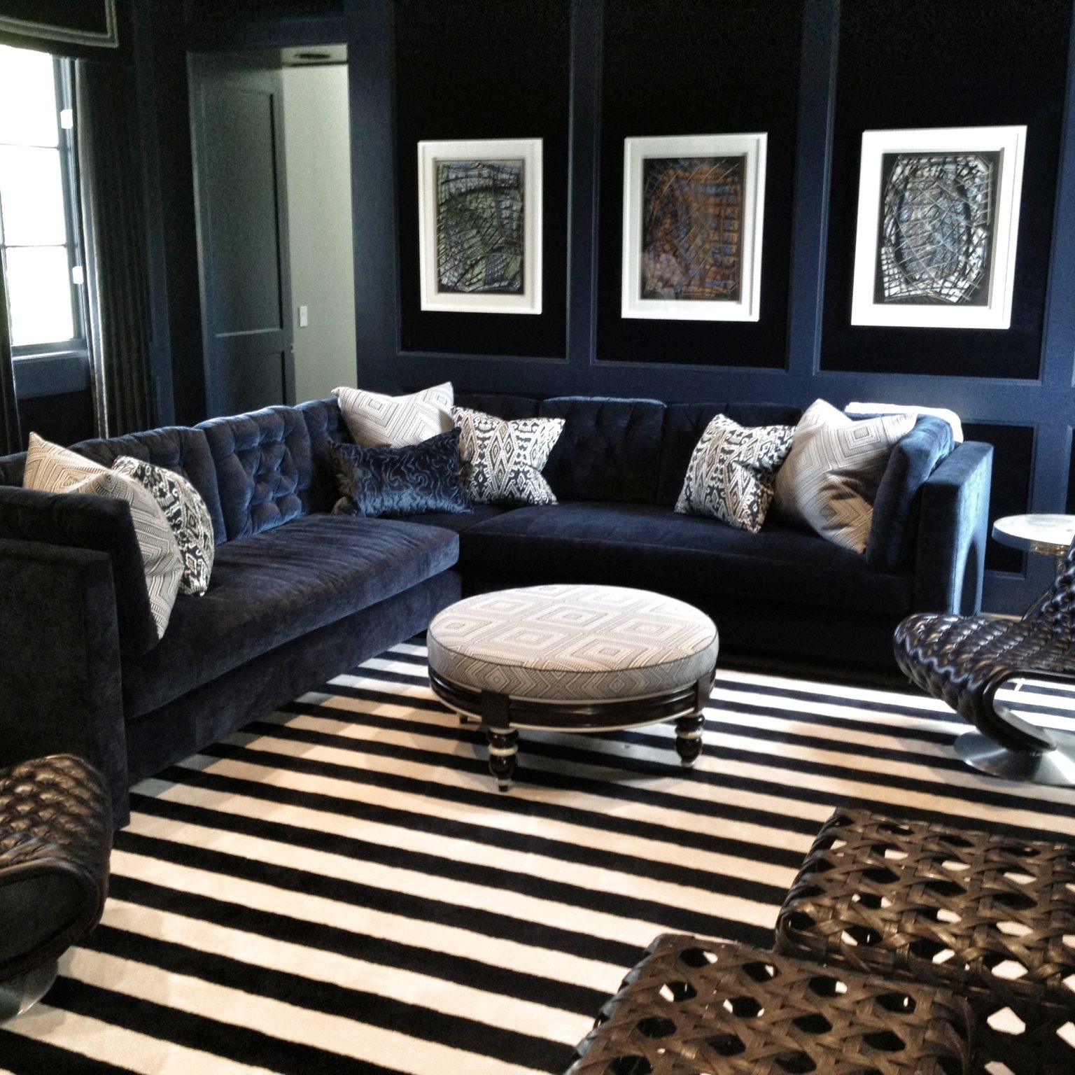 Dark living room interior design with blu velvet sofa