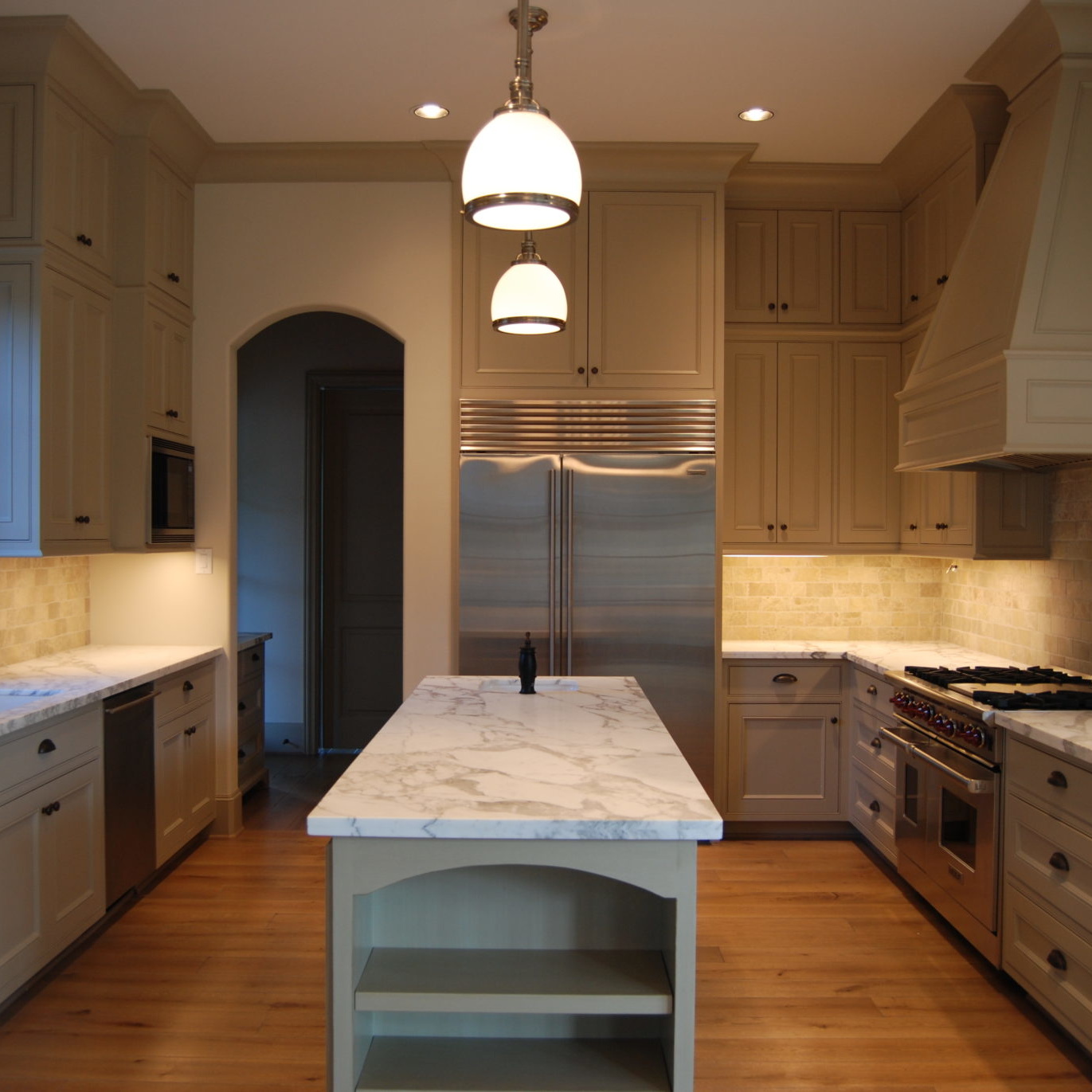Newly remodeled kitchen with white marble countertops
