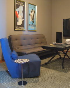 Media room interior design with gray futon