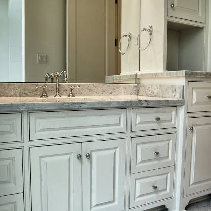 Newly remodeled bathroom with gray marble countertops