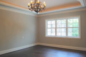Empty room with large windows and beautiful chandelier