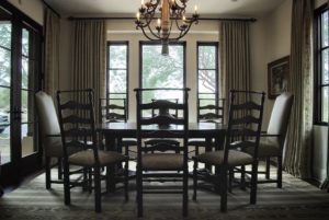 Dining room interior design with a dark wood table